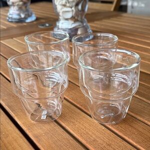 Bodum double-wall glass.  These glasses are designed to keep drinks hot or cold.